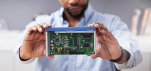 Circuit board, hands and technician with computer hardware, man in office with maintenance and elec.