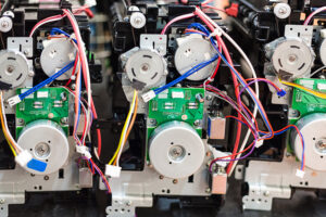view of circuit boards on cartridges during the assembling of new printers in workshop